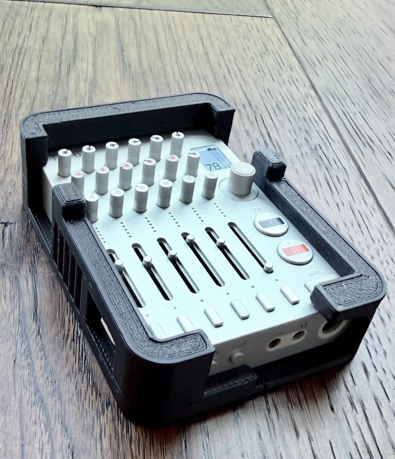 TX-6 in a Carbon bumper, seen from above, every fader, knob and button exposed